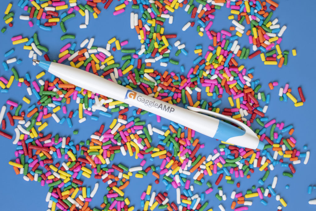 Javalina Splash promotional blue trim pen on sprinkles and blue background